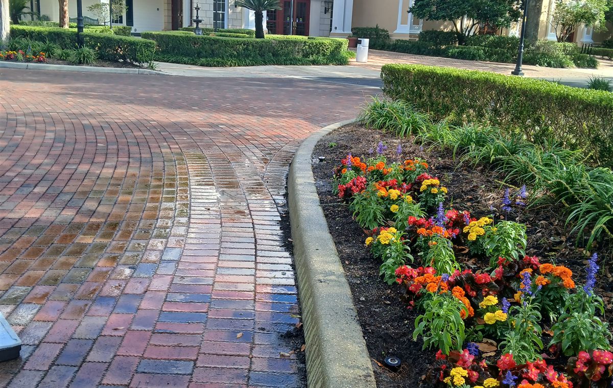Real Green Horse landscape bed with flowers and curb detail