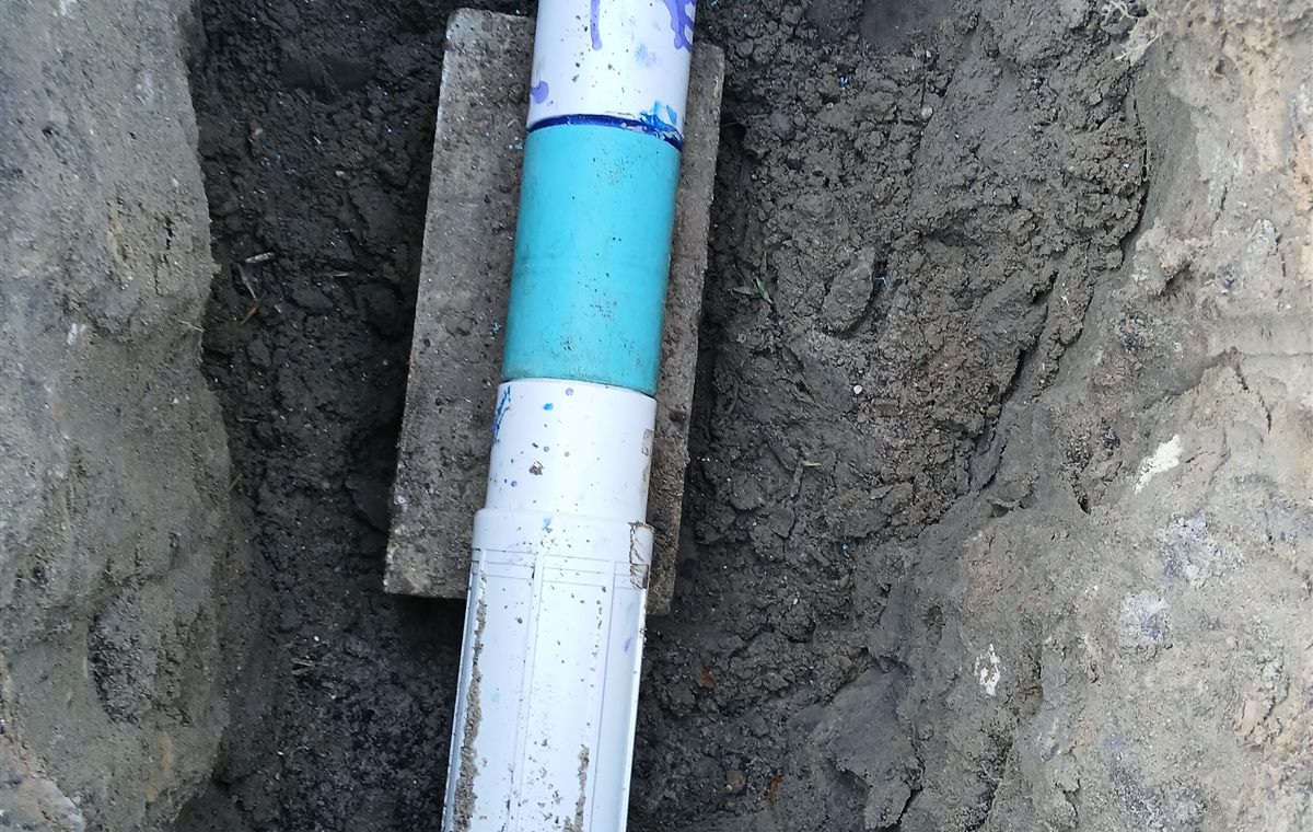 Real sprinkler pipe installation and repair trench